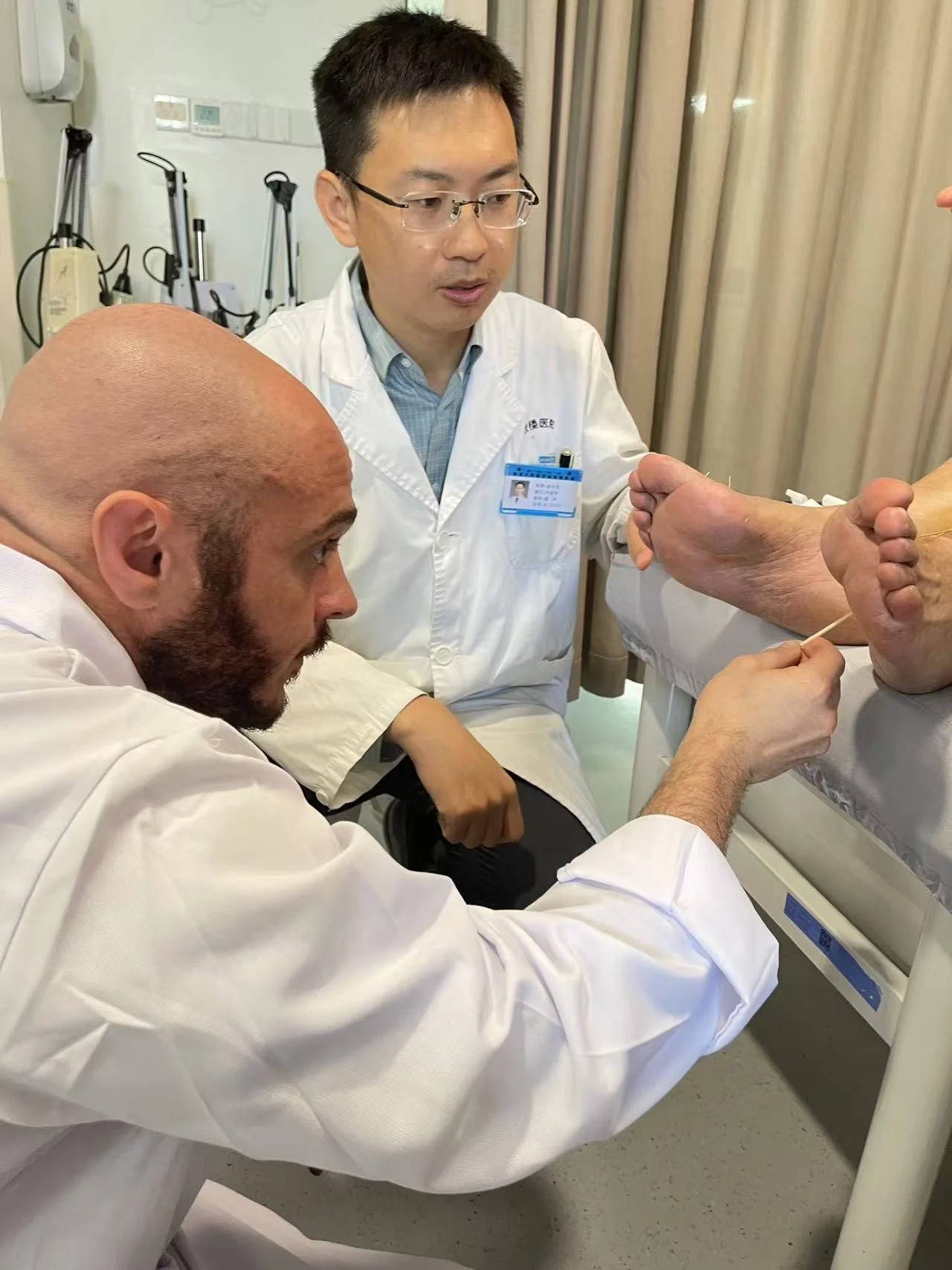 Philip treating a patient in China at Nanjing General Hospital