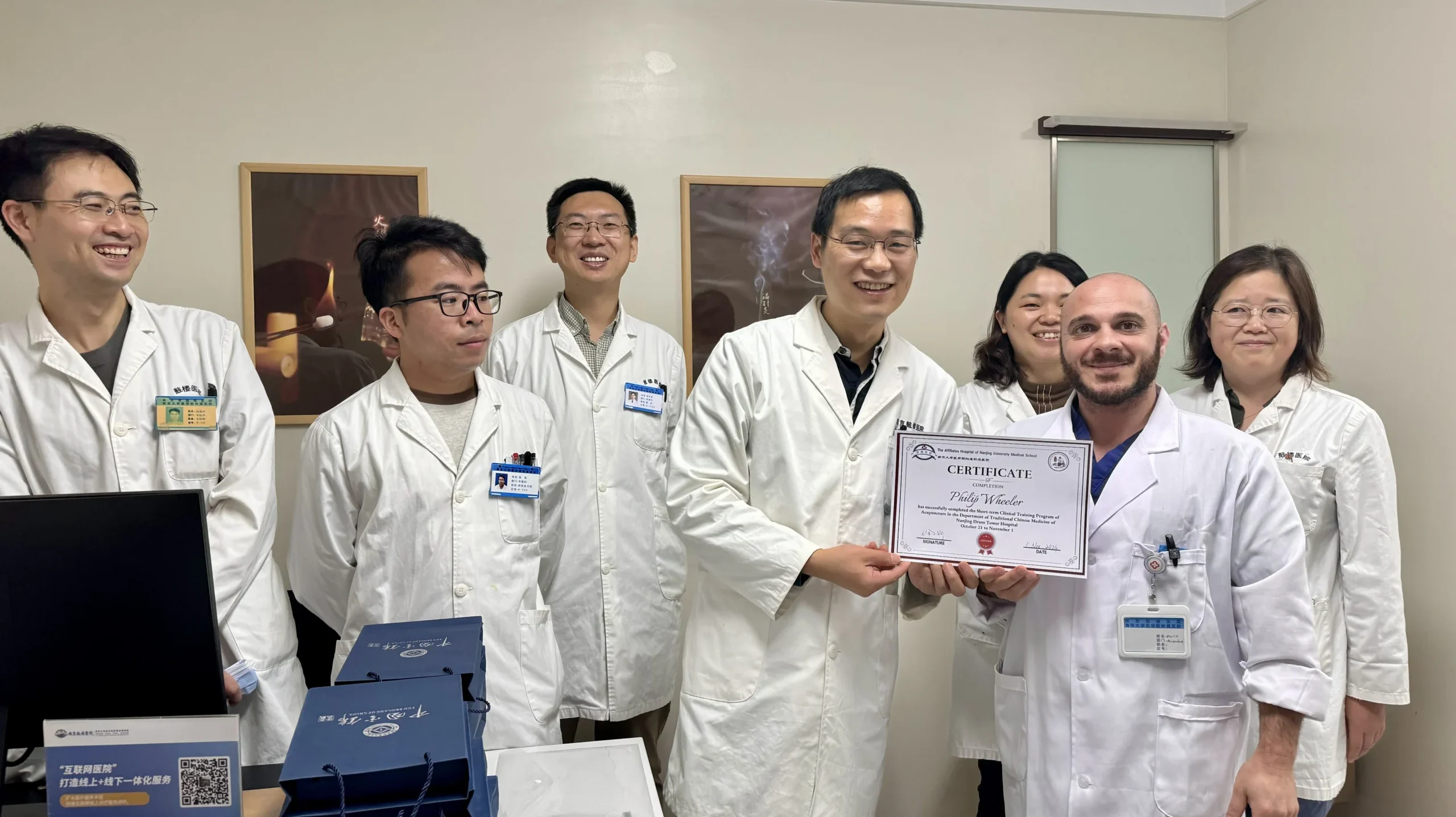 Philip receiving his certificate from Nanjing General Hospital.